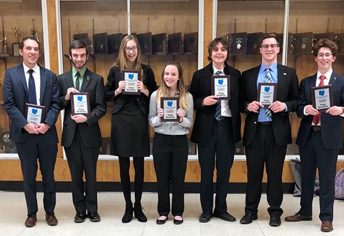 High School Debate Team with State Qualifier Plaques