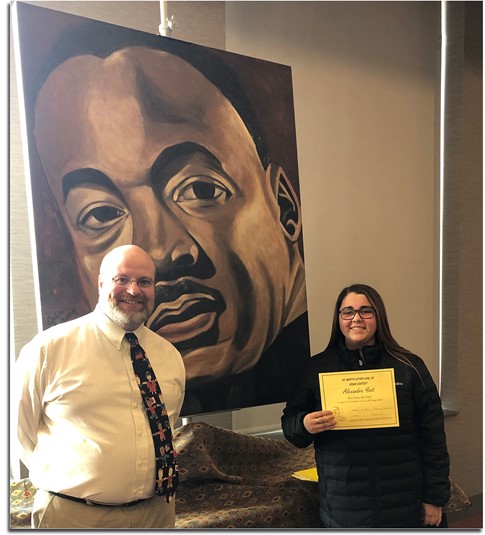 Alex Yost one of the Dr. Martin Luther King Jr. Essay Contest winners with Mr. Fetters.