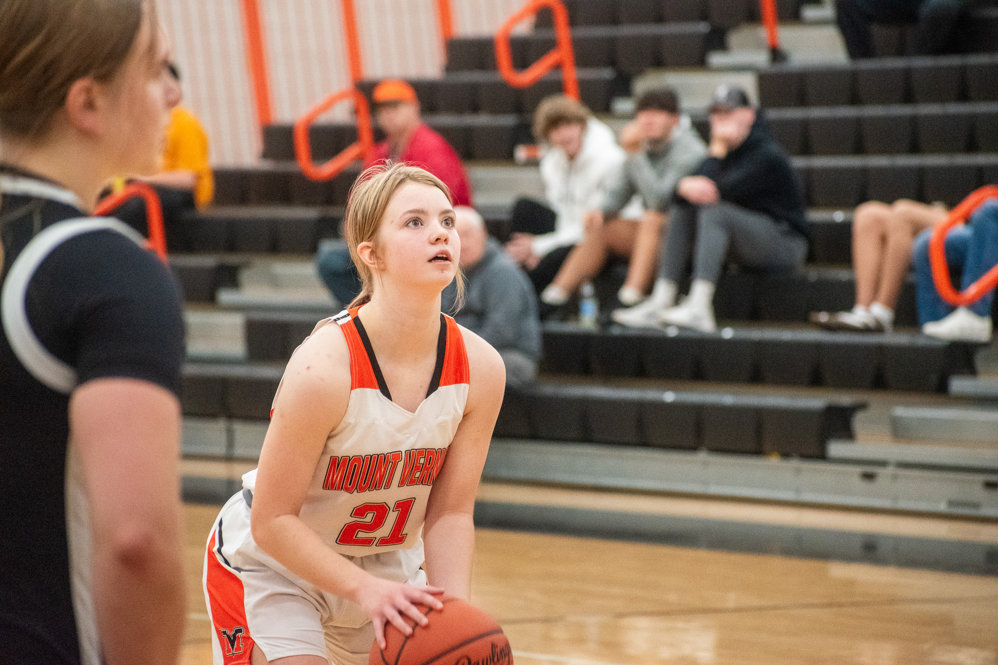 Girls basketball player dribbling the ball.