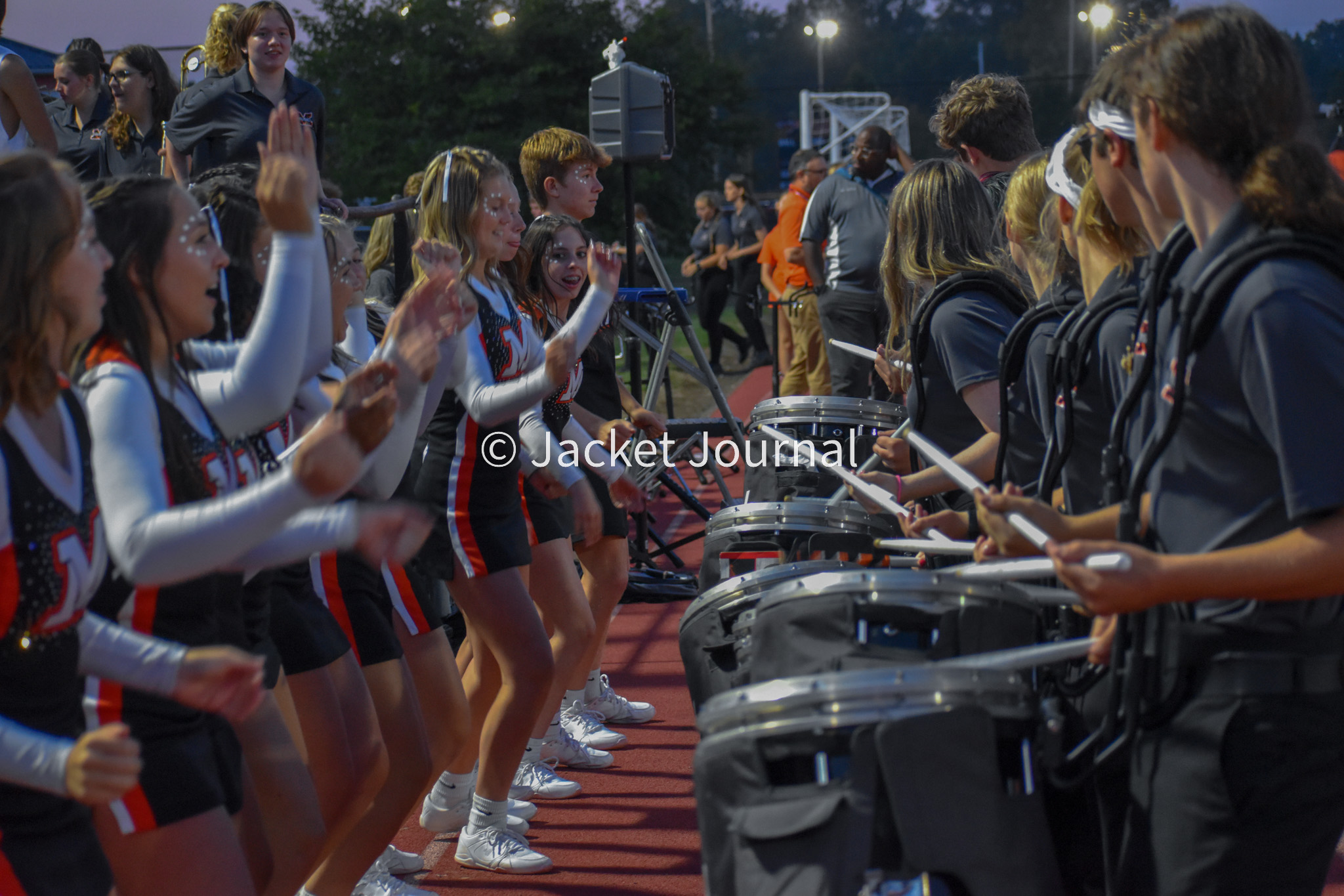 The HIVE cheering during a home football game.