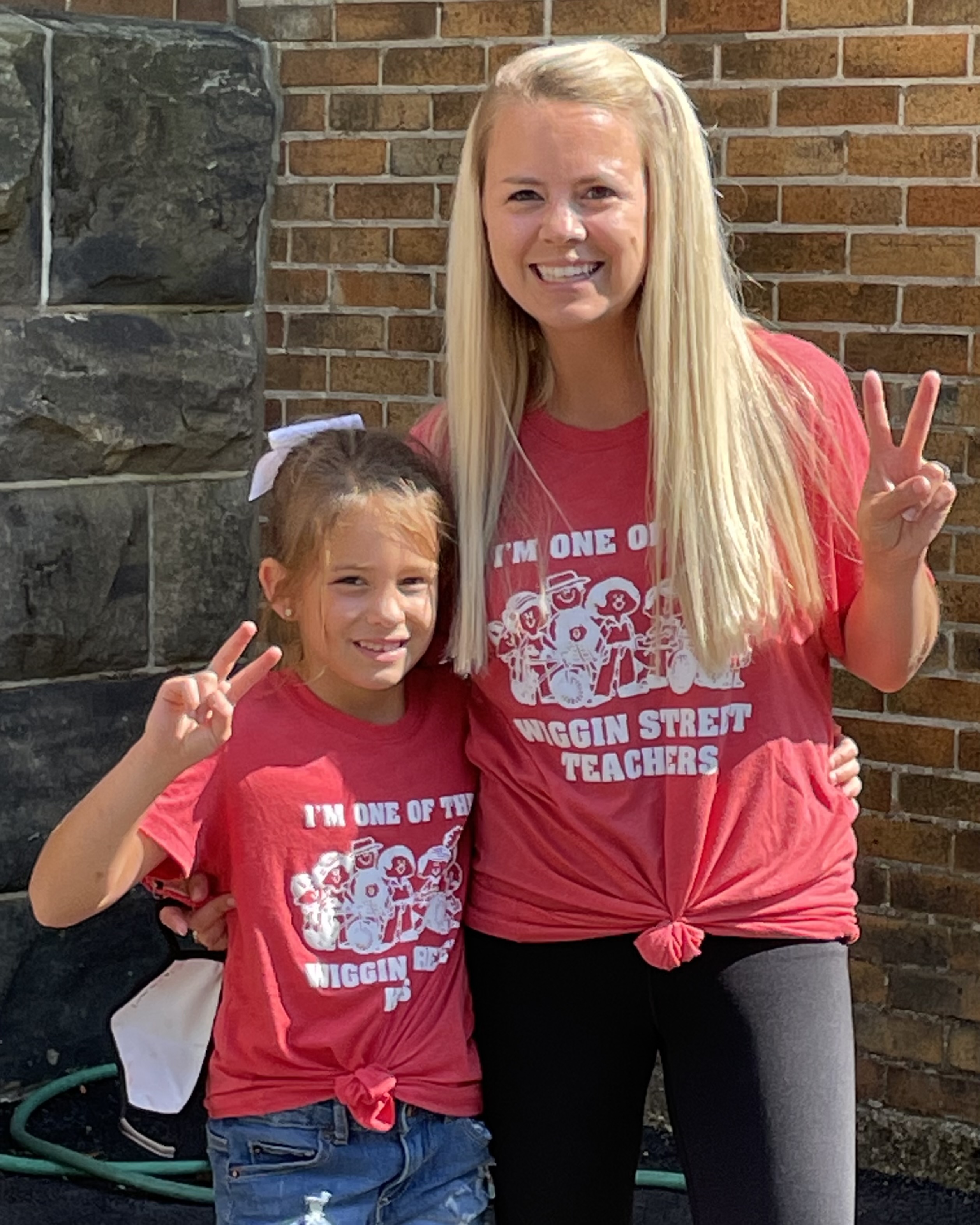 Parent and child in spirit wear.