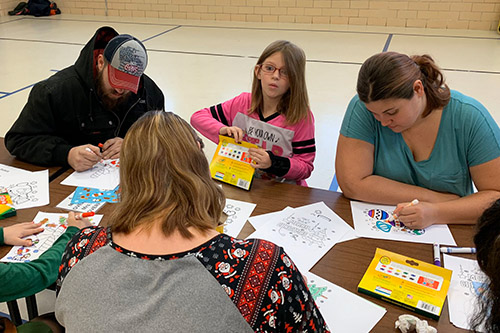 Dan Emmett students and families working on art projects.