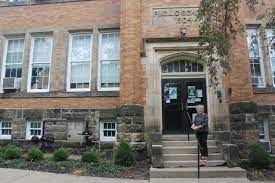 Principal at Wiggin Street Elementary entrance.