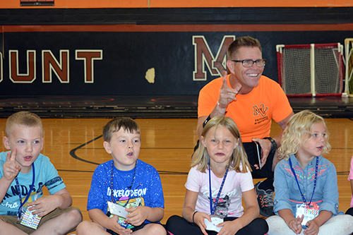 Physical Education teacher with students.