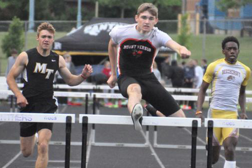Erich Rhodeback clears the last hurdle winning the State Championship 300 meter hurdles.