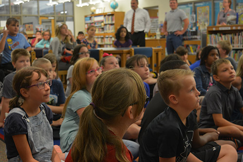 Twin Oak students meeting in the school library.