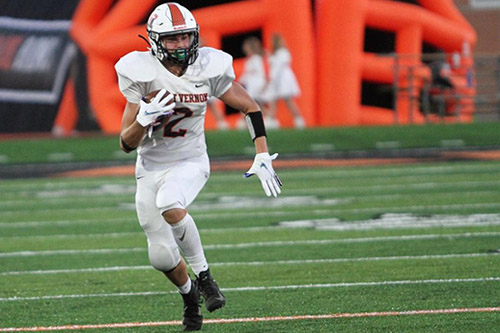 Football player running with the ball.