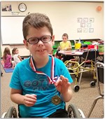 Picture of student winning the gold medal for reading!