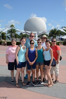 Picture of Mrs. Bell and family at Disney World